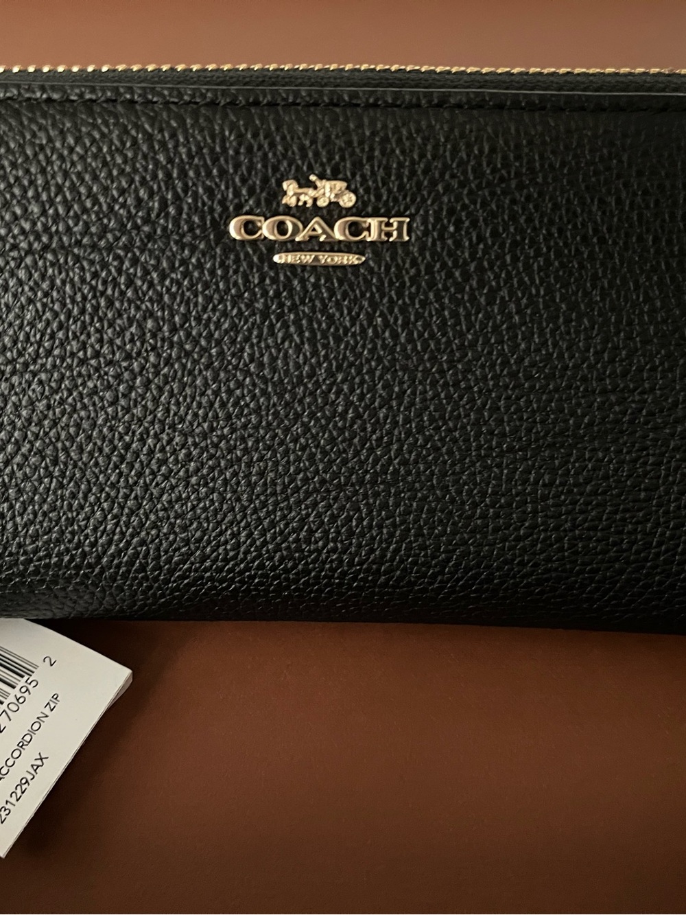 Coach Black Pebbled Leather Zip Around Wallet with Gold Logo